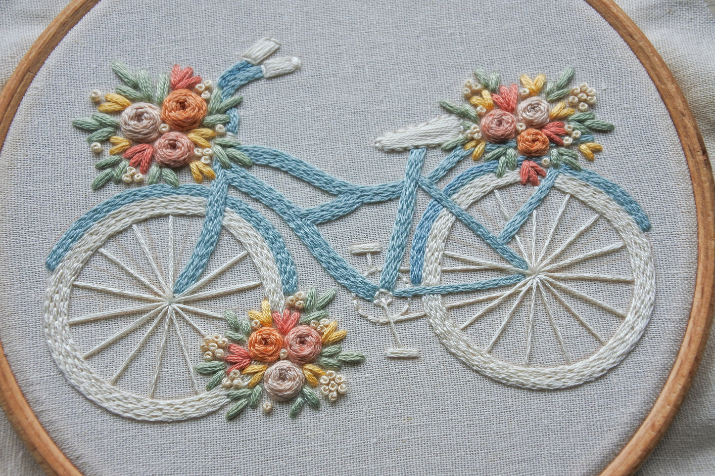 Close-up of the completed hand-embroidered floral bike design.