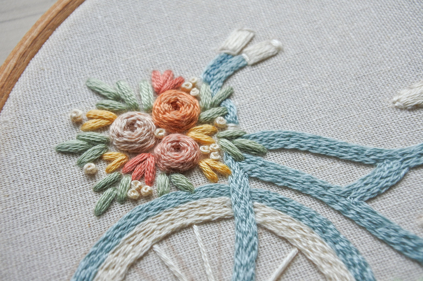 Close-up of a colourful floral bouquet in the floral bicycle embroidery design.
