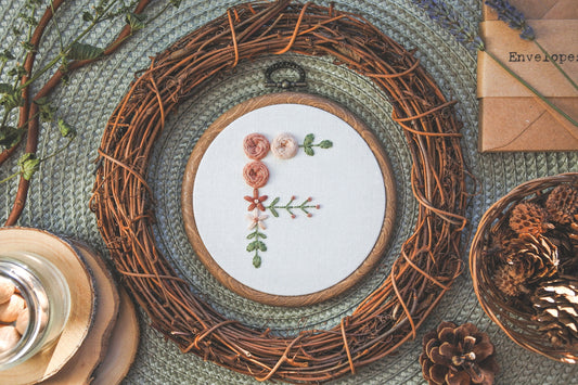 Peach floral letter F embroidery hoop