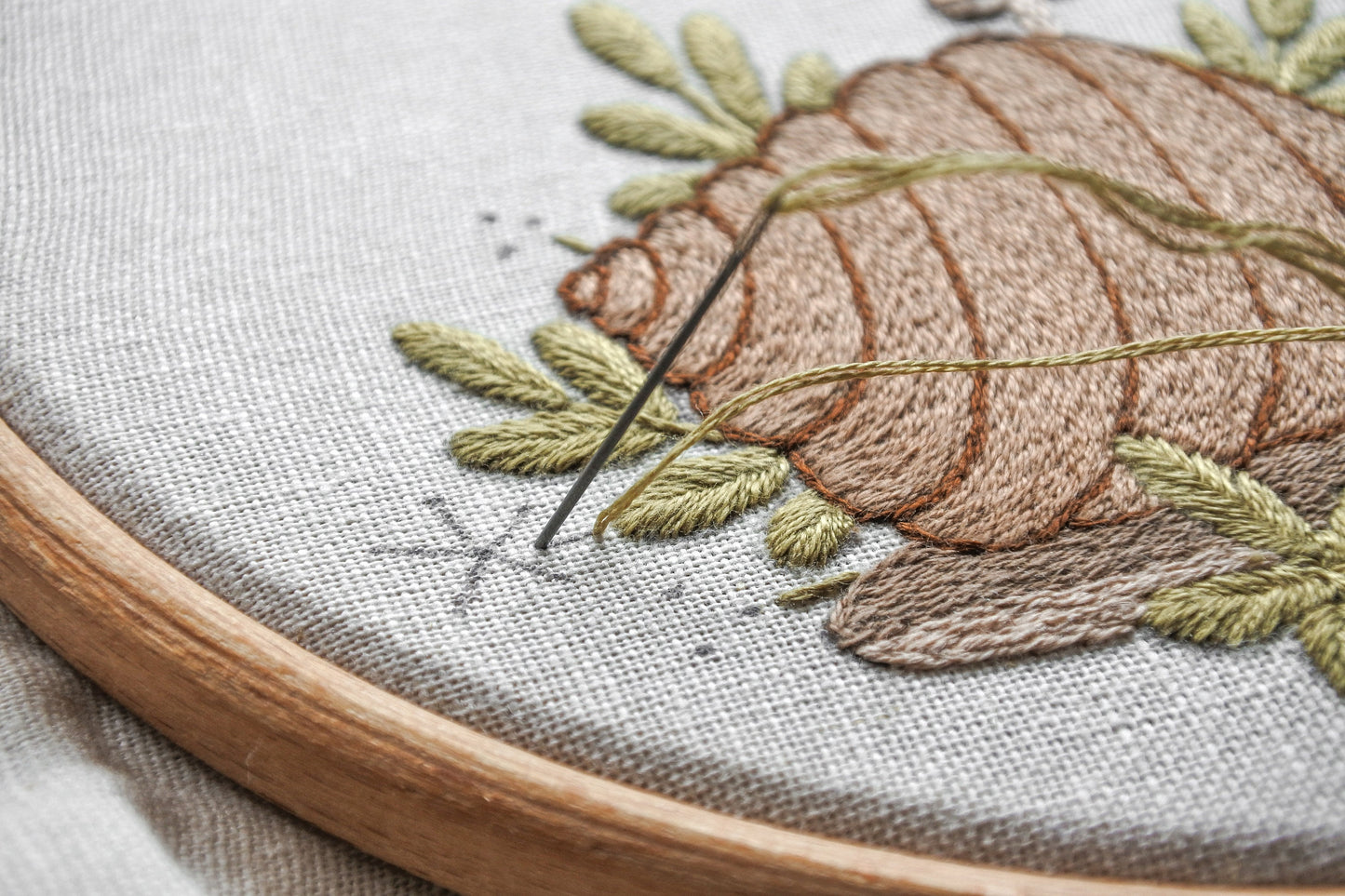Progress shot of needle and thread stitching details