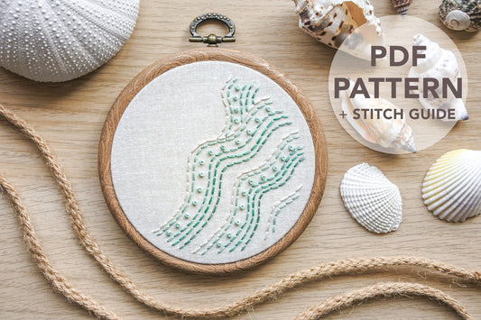 Beginner-friendly beach wave embroidery hoop stitched with turquoise and white thread using backstitch and French knots. Text on image reads ‘PDF pattern + stitch guide’.