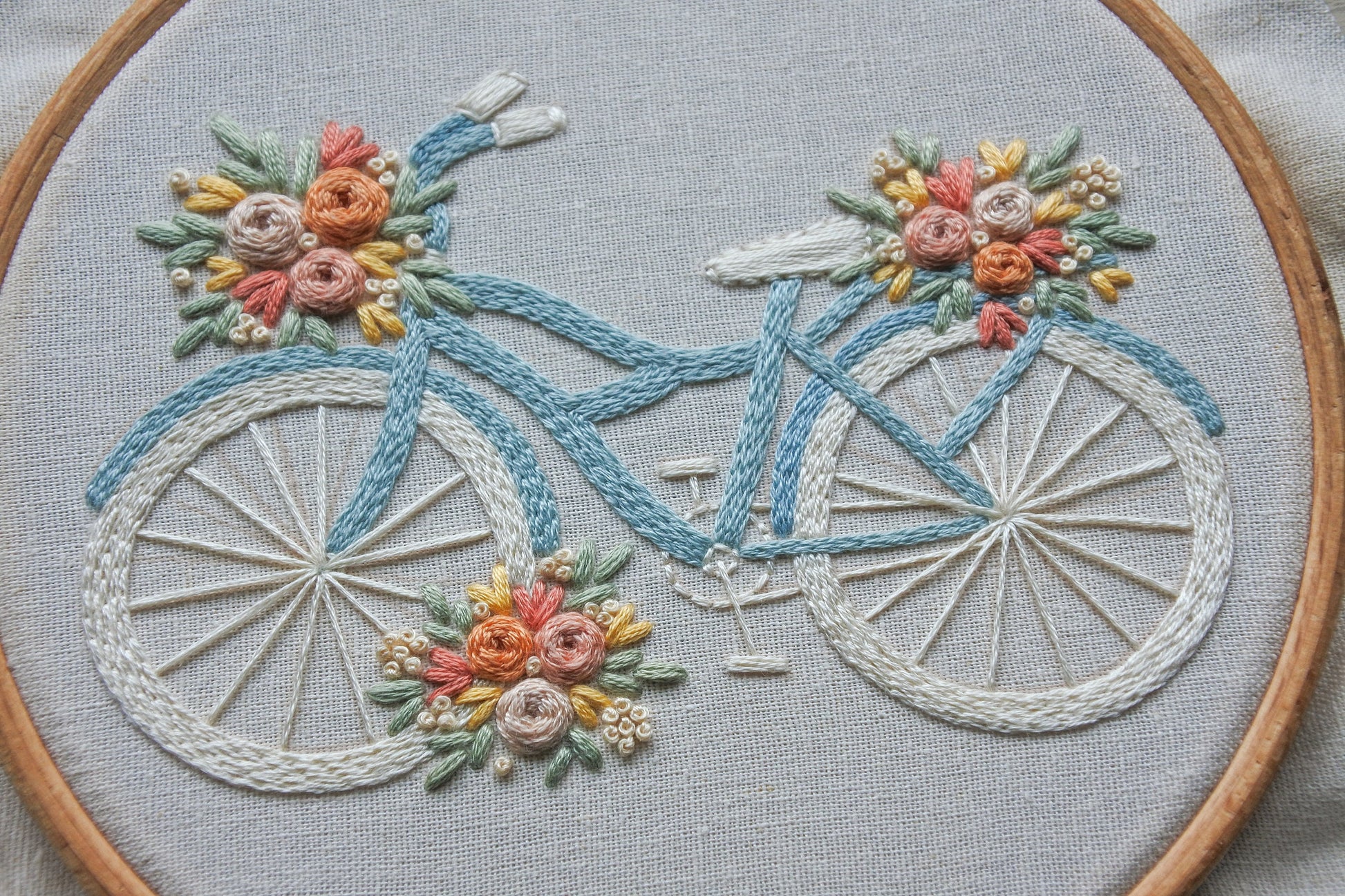 Close-up of the completed hand-embroidered floral bike design.