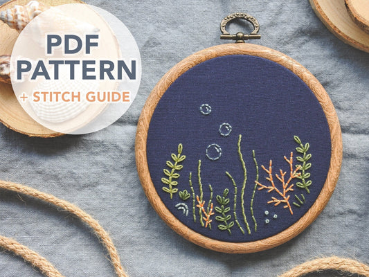 Coral reef embroidery design on navy blue fabric with underwater bubbles. Text on image says 'PDF Pattern and stitch guide'