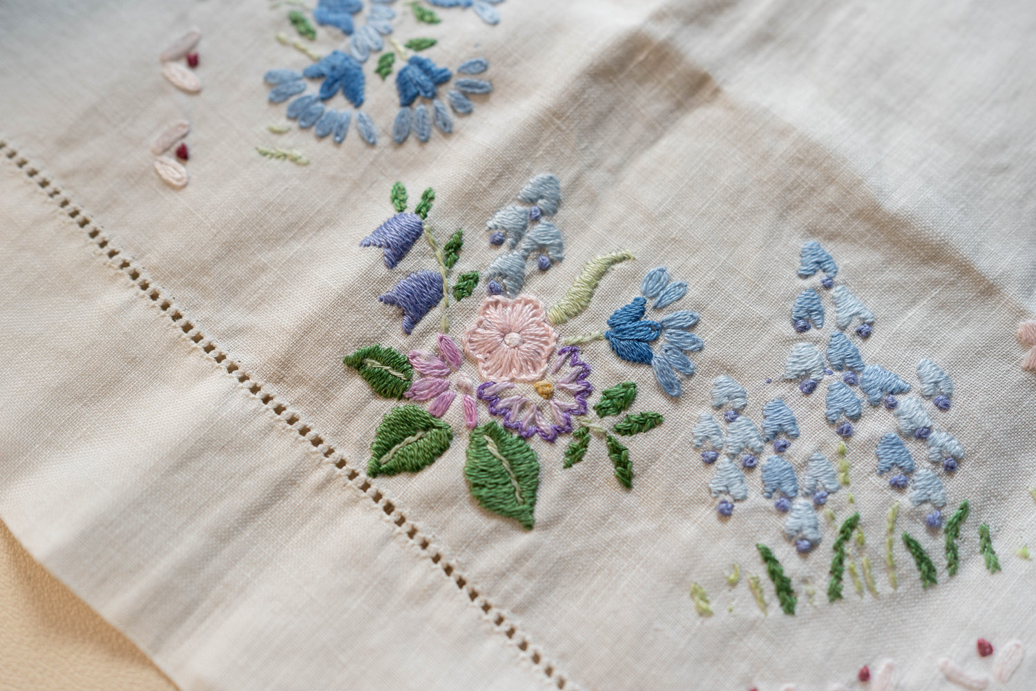 Delicate floral embroidery on a cloth sewn by Catherine’s Nan