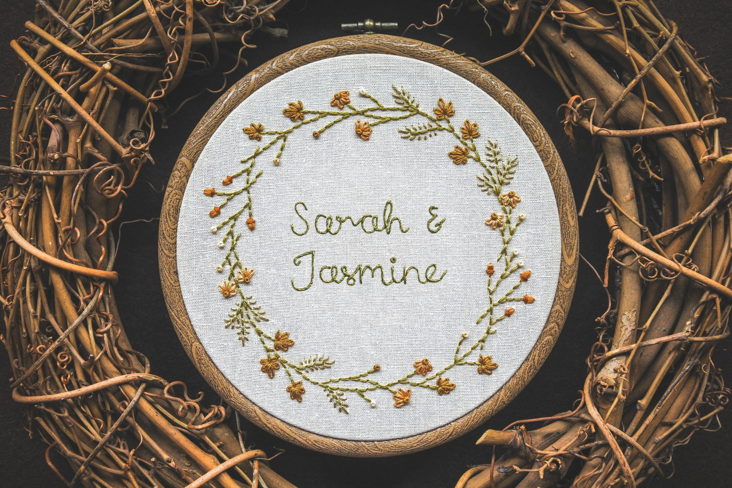 Autumn-themed embroidered hoop with the names Sarah and Jasmine in the centre