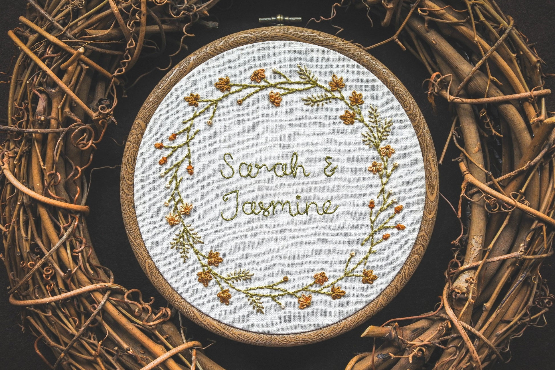 Autumn-themed embroidered hoop with the names Sarah and Jasmine in the centre