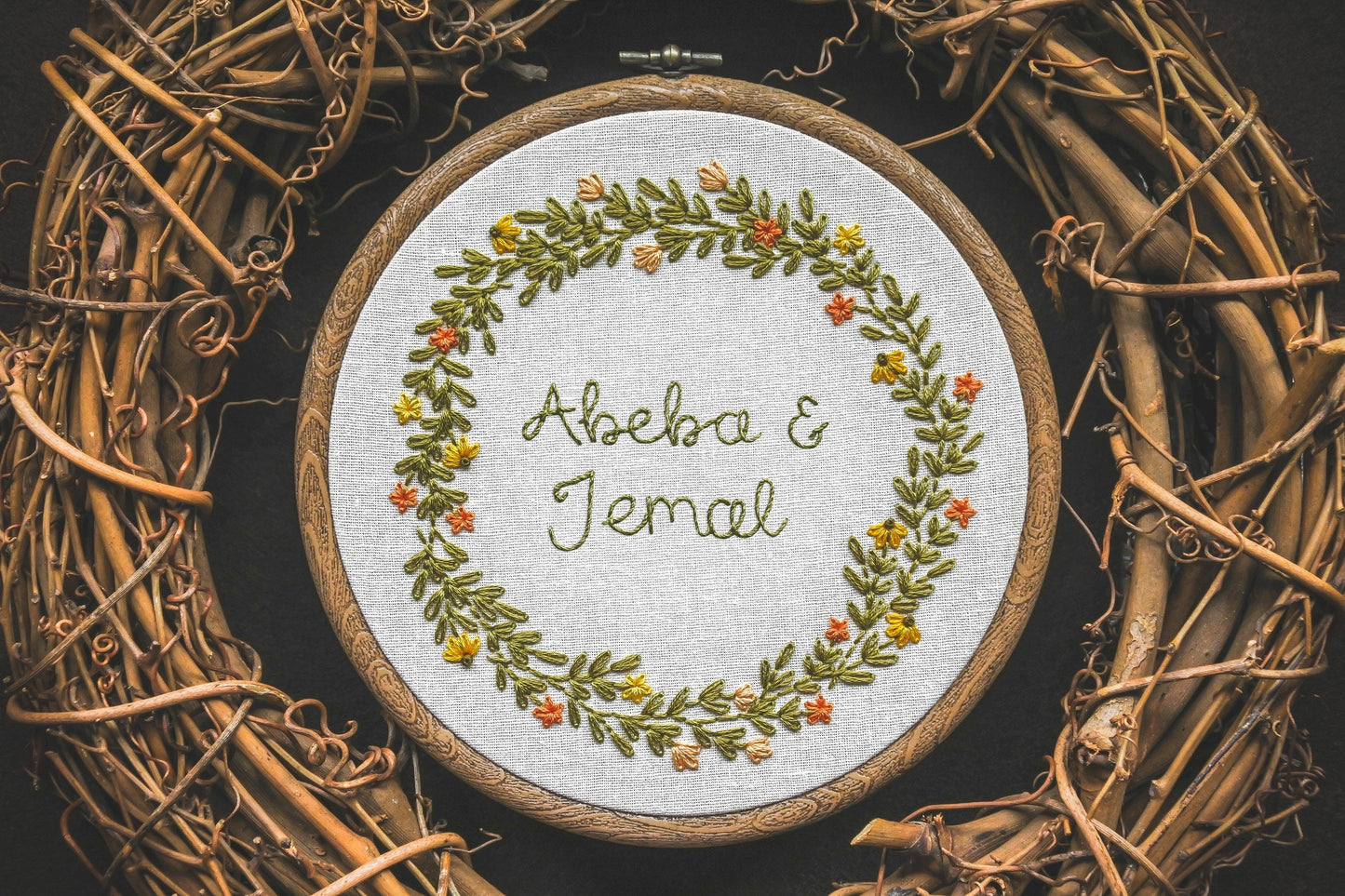 Custom summer wreath design with the names "Abeba and Jemal" embroidered in the centre.