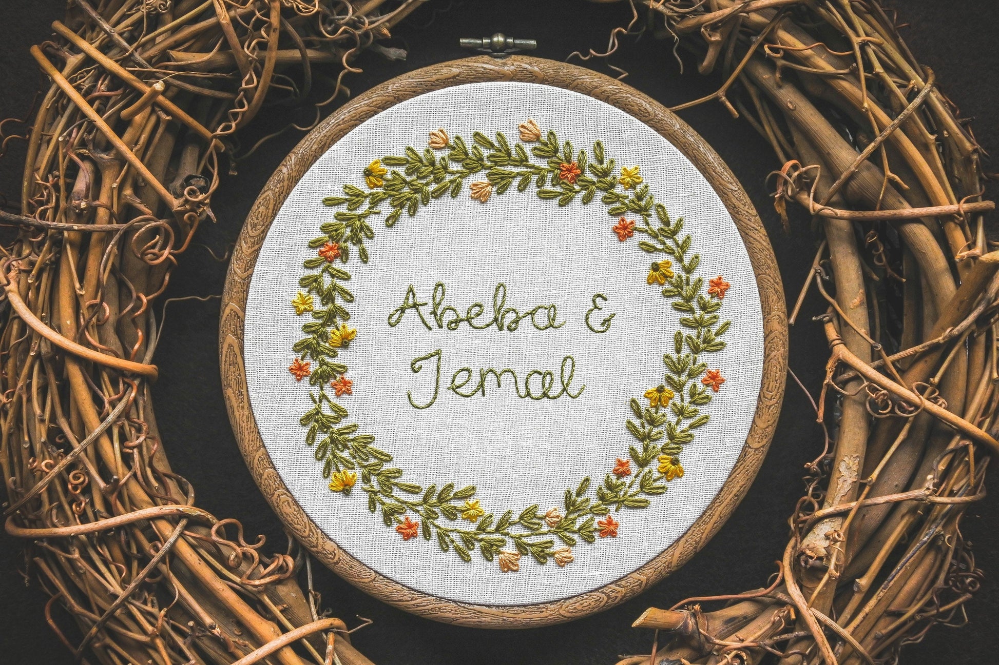 Custom summer wreath design with the names "Abeba and Jemal" embroidered in the centre.